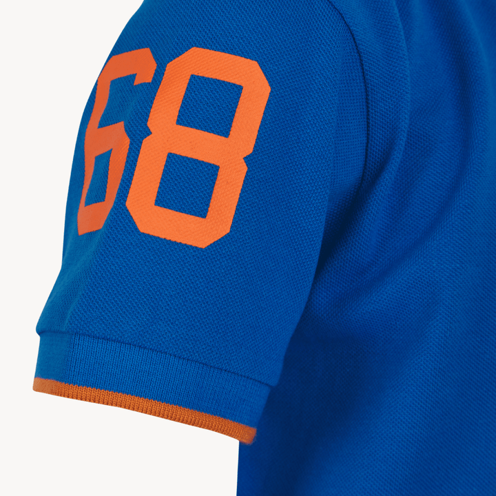 Boys Tokyo Laundry Blue Rubber Badge Polo Shirt from You Know Who's