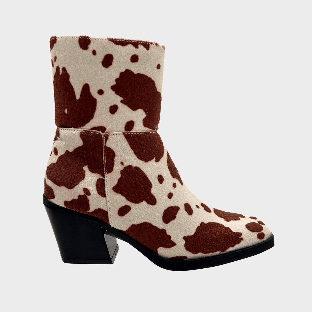 Ladies Cow Print Heeled Cowboy Boots from You Know Who's
