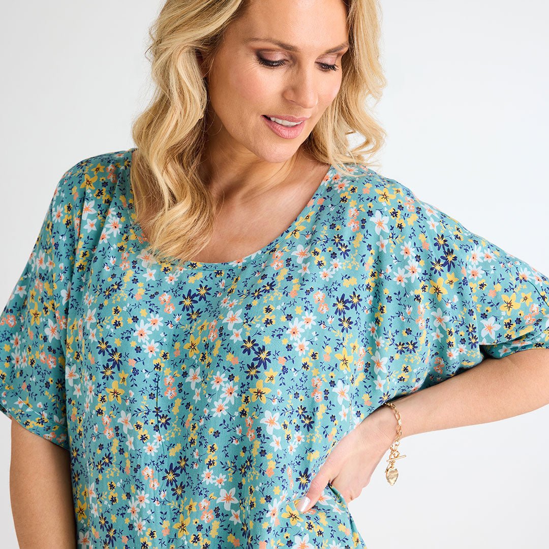 Ladies Floral Dipped Hem Top from You Know Who's