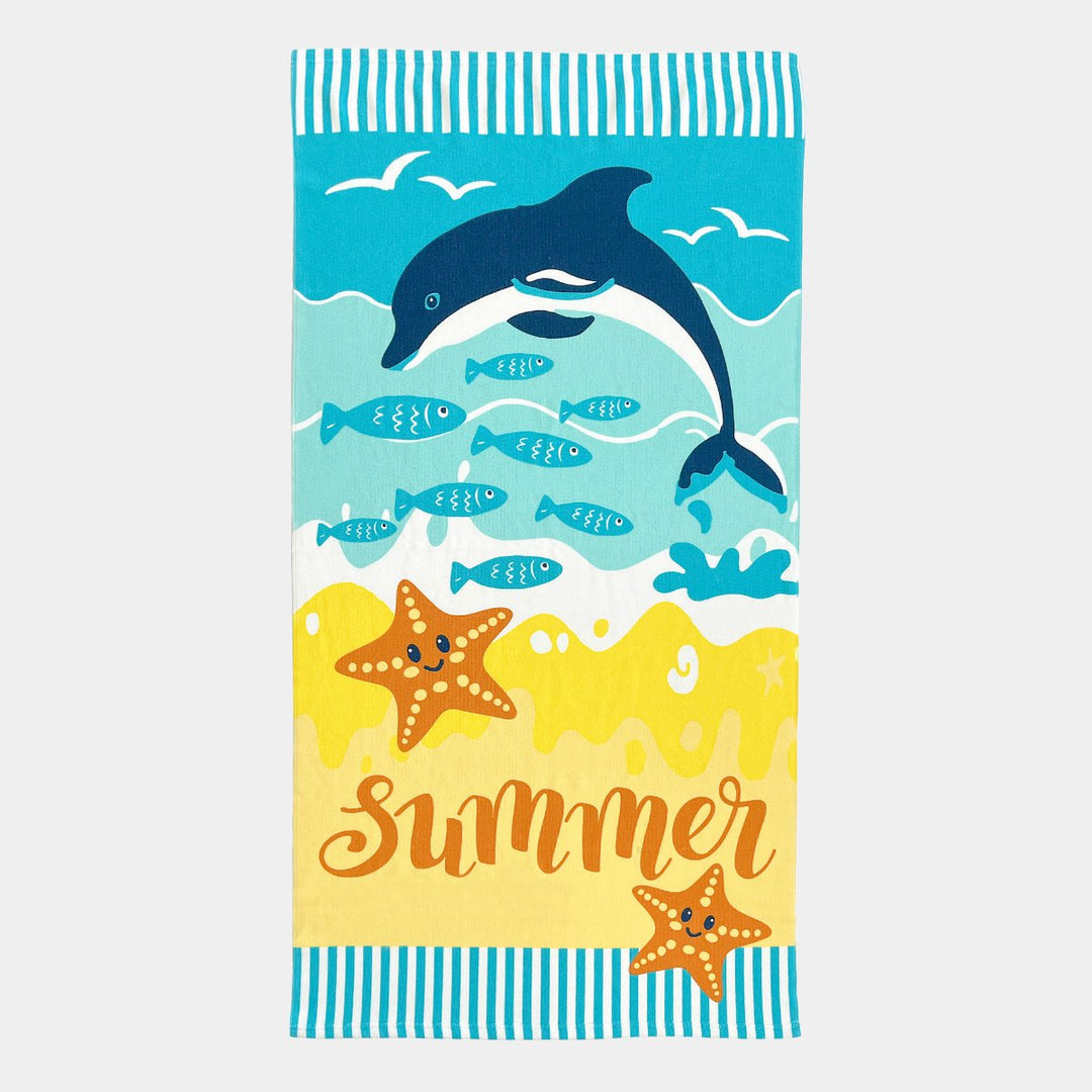 Towel for kids with printed dolphin on a beach